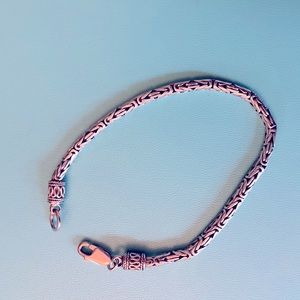 Silver filigree snake bracelet.